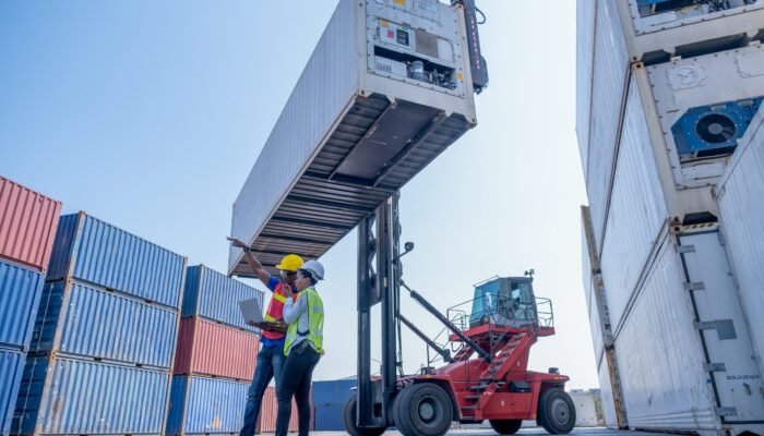 wide-shot-of-couple-foreman-and-technician-or-carg-2023-11-27-04-51-22-utc